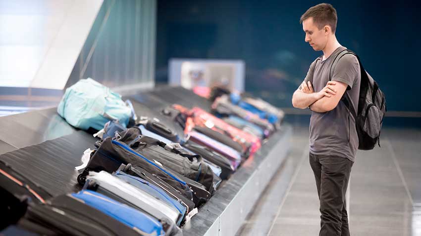 Checked Luggage Waiting To Be Collected On A Conveyor Belt